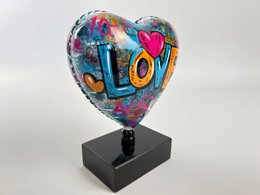 "Love" Heart sculpture or statue in multi-colored resin. Height 25 and width 18 centimeters