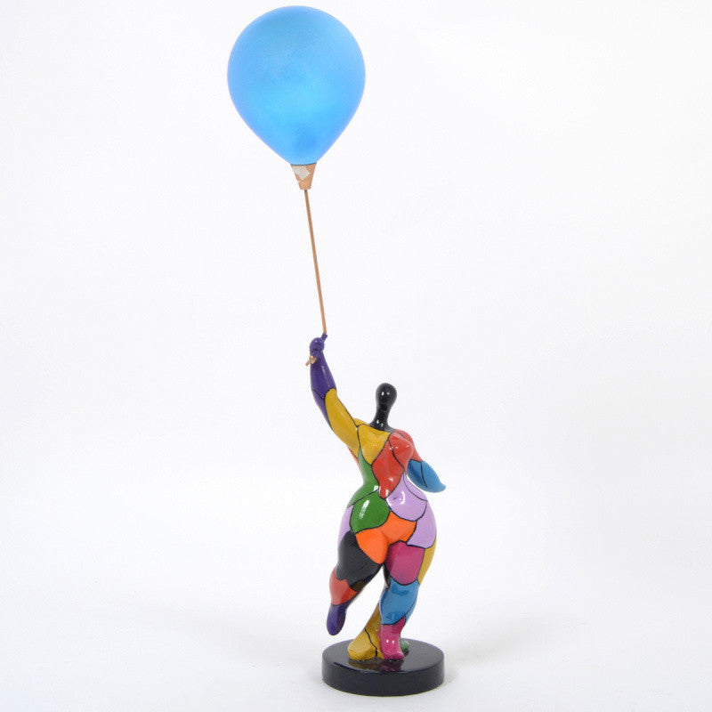 Round, multi-colored statue of a woman with a ball, Nana style, made of resin. Total height 63 centimeters