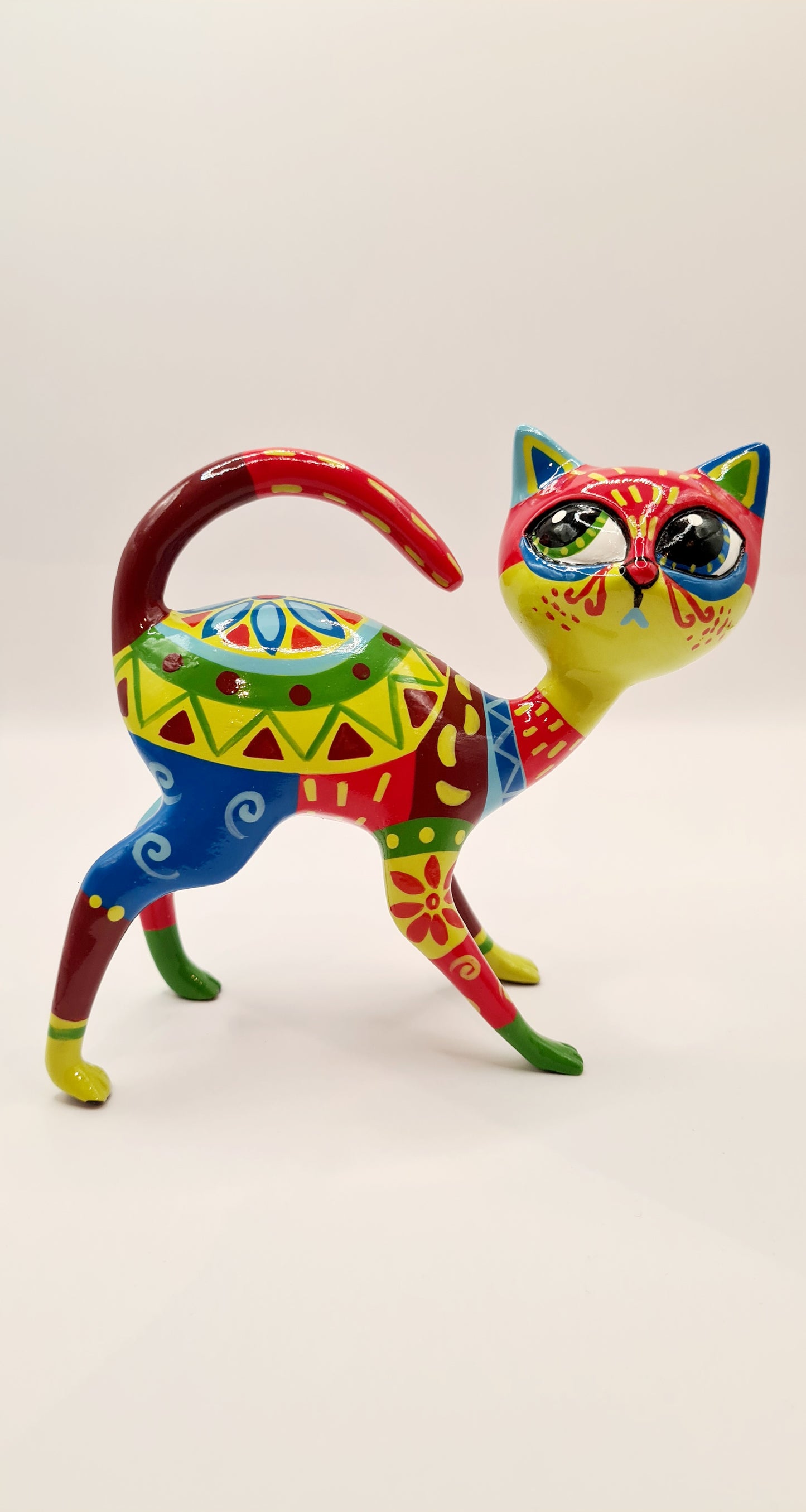 Multicolored resin Mexican cat statue. Length 5'5 inches (14 centimeters)