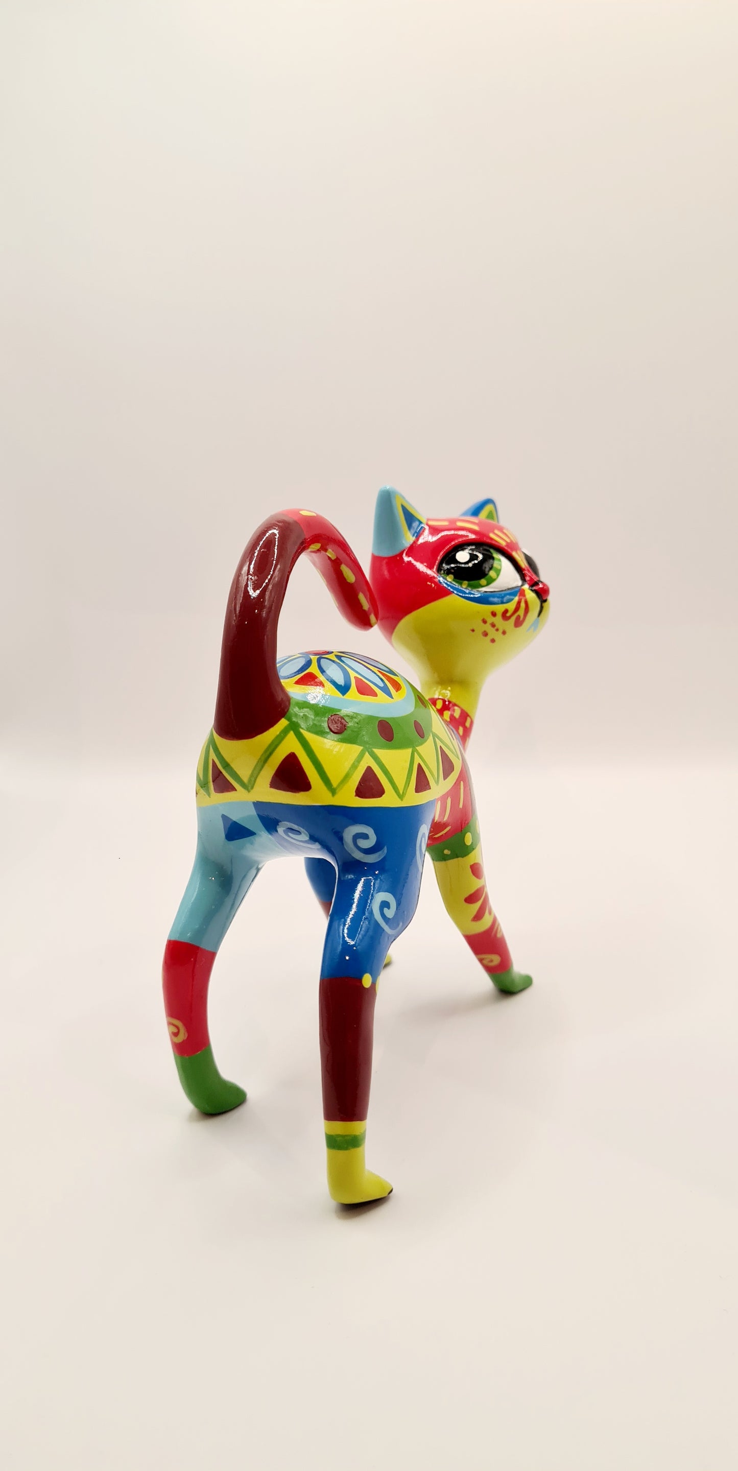 Multicolored resin Mexican cat statue. Length 5'5 inches (14 centimeters)