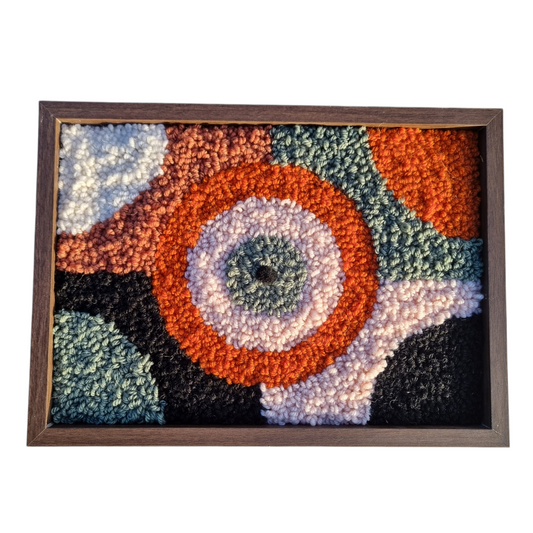 Wall hanging made with punch needle or tufting wool, warm tones of beige, brown, and orange. One-of-a-kind piece, 23 × 31 cm