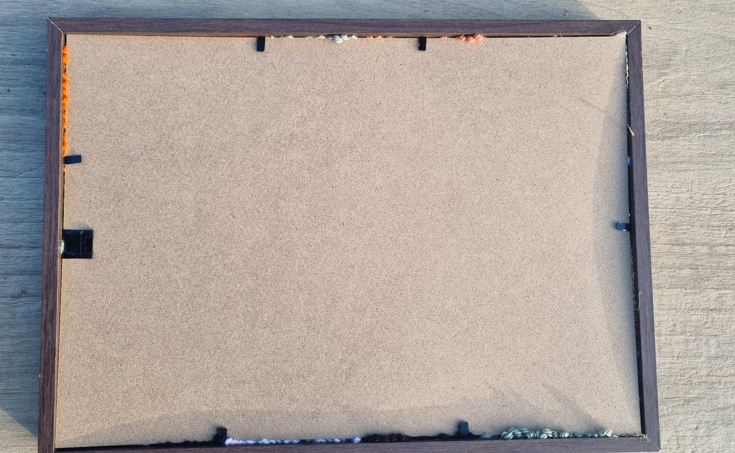Wall hanging made with punch needle or tufting wool, warm tones of beige, brown, and orange. One-of-a-kind piece, 23 × 31 cm