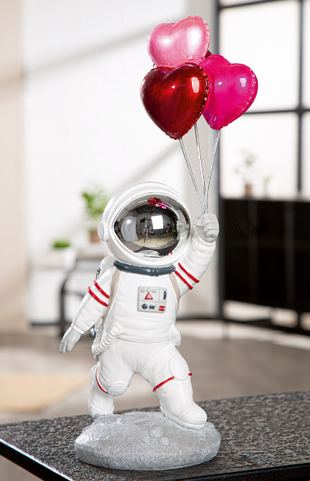 Resin astronaut statue or figurine with heart balloons. Height 39 cm