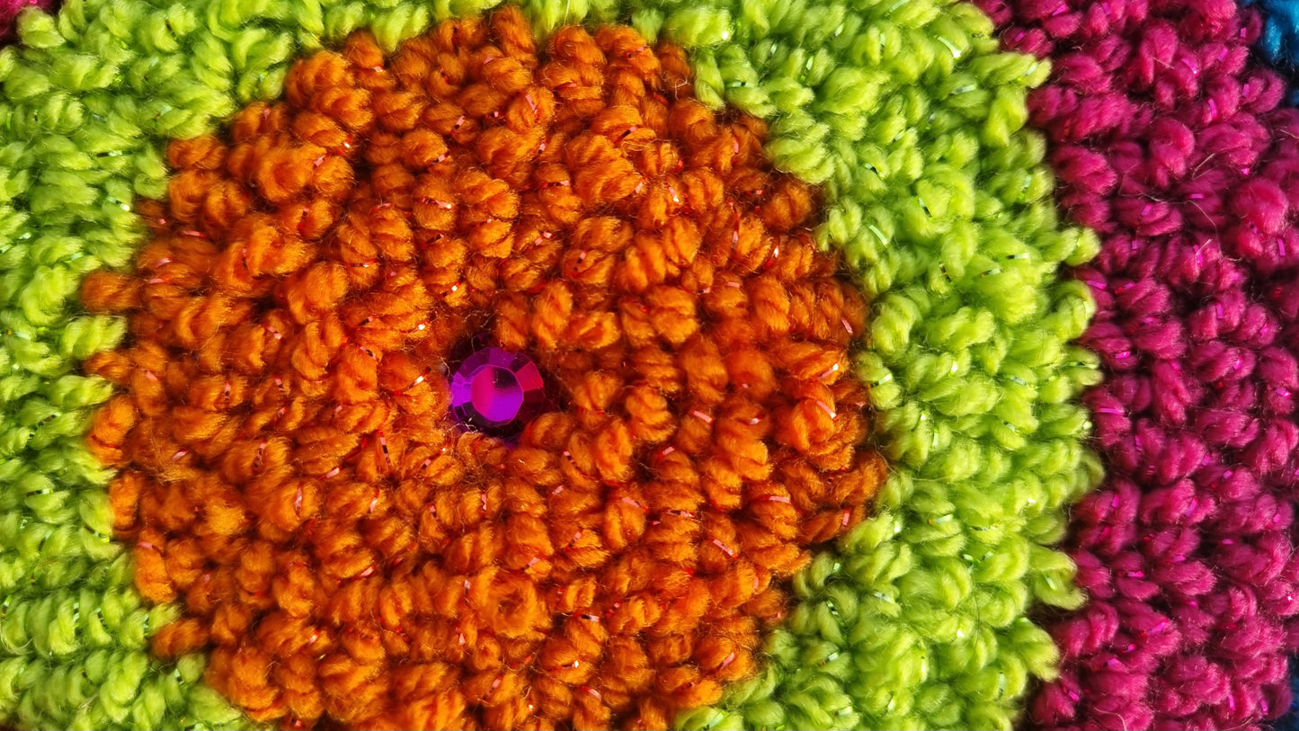 Wall hanging made with punch needle or tufting wool, warm tones of beige, brown, and orange. One-of-a-kind piece, 15 × 20 cm