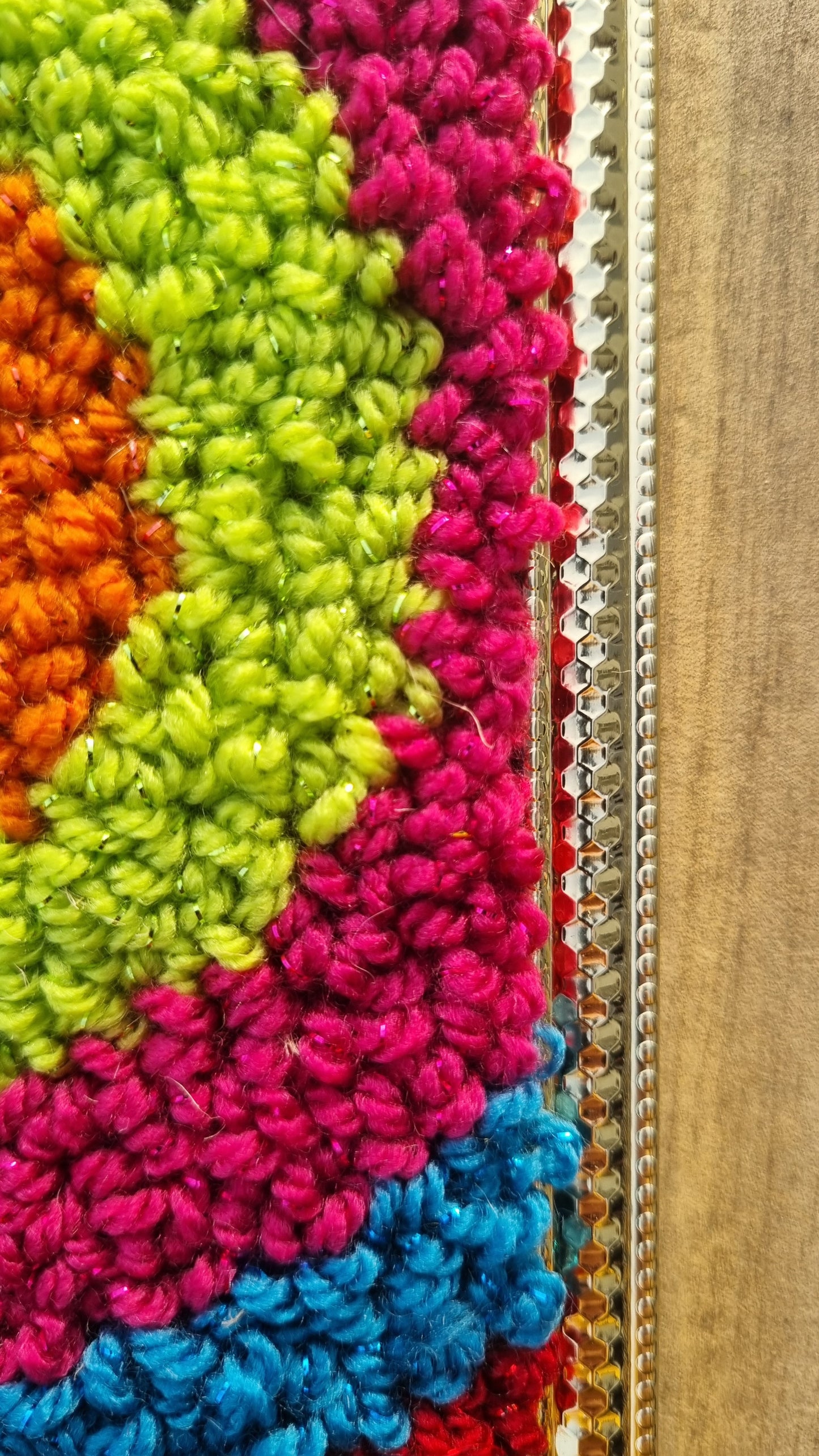 Wall hanging made with punch needle or tufting wool, warm tones of beige, brown, and orange. One-of-a-kind piece, 15 × 20 cm