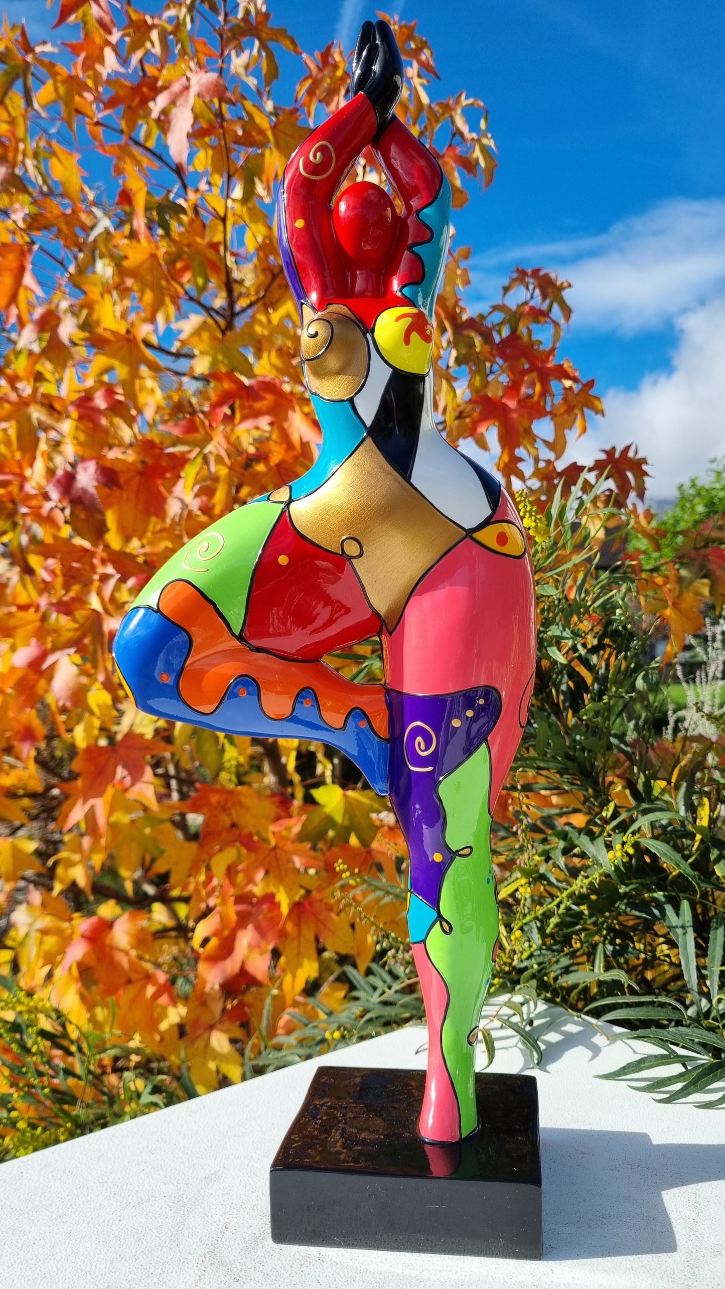 Statue of a dancing woman, in multicolored resin, height 52 centimeters