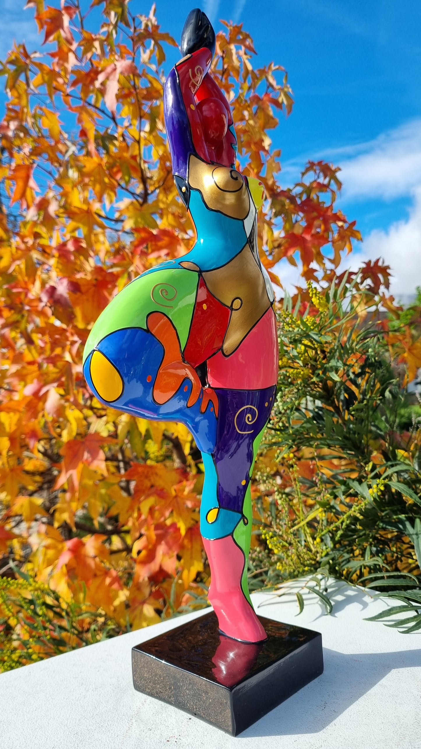Statue of a dancing woman, in multicolored resin, height 52 centimeters