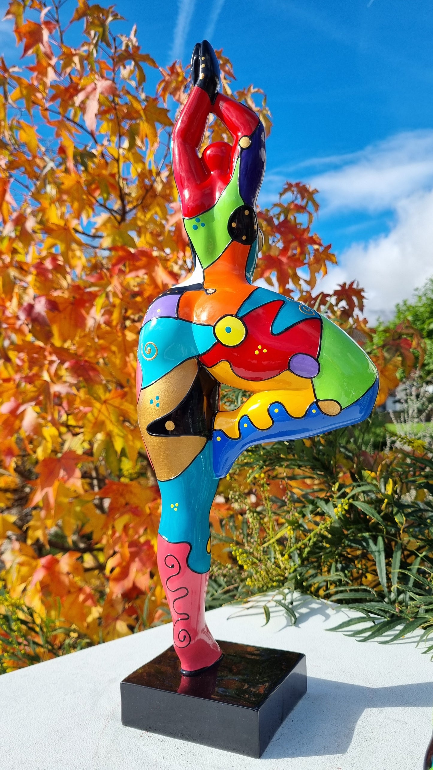 Statue of a dancing woman, in multicolored resin, height 52 centimeters