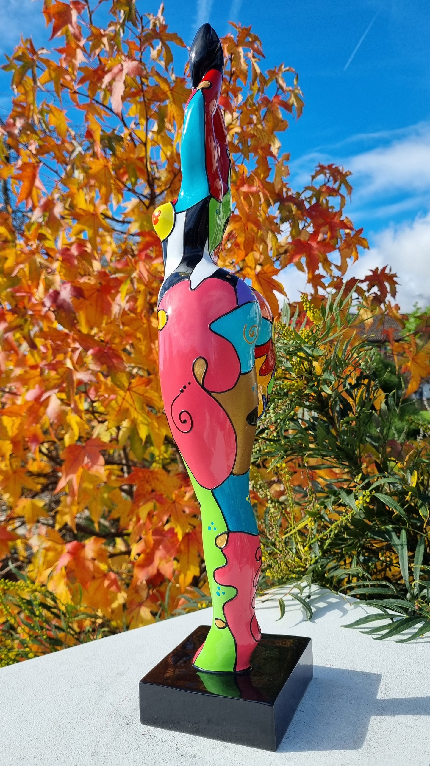 Statue of a dancing woman, in multicolored resin, height 52 centimeters