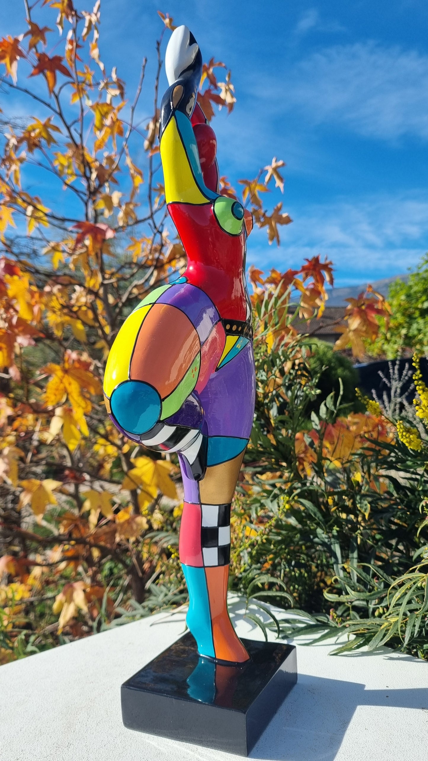 Statue of a dancing woman, in multicolored resin, height 52 centimeters