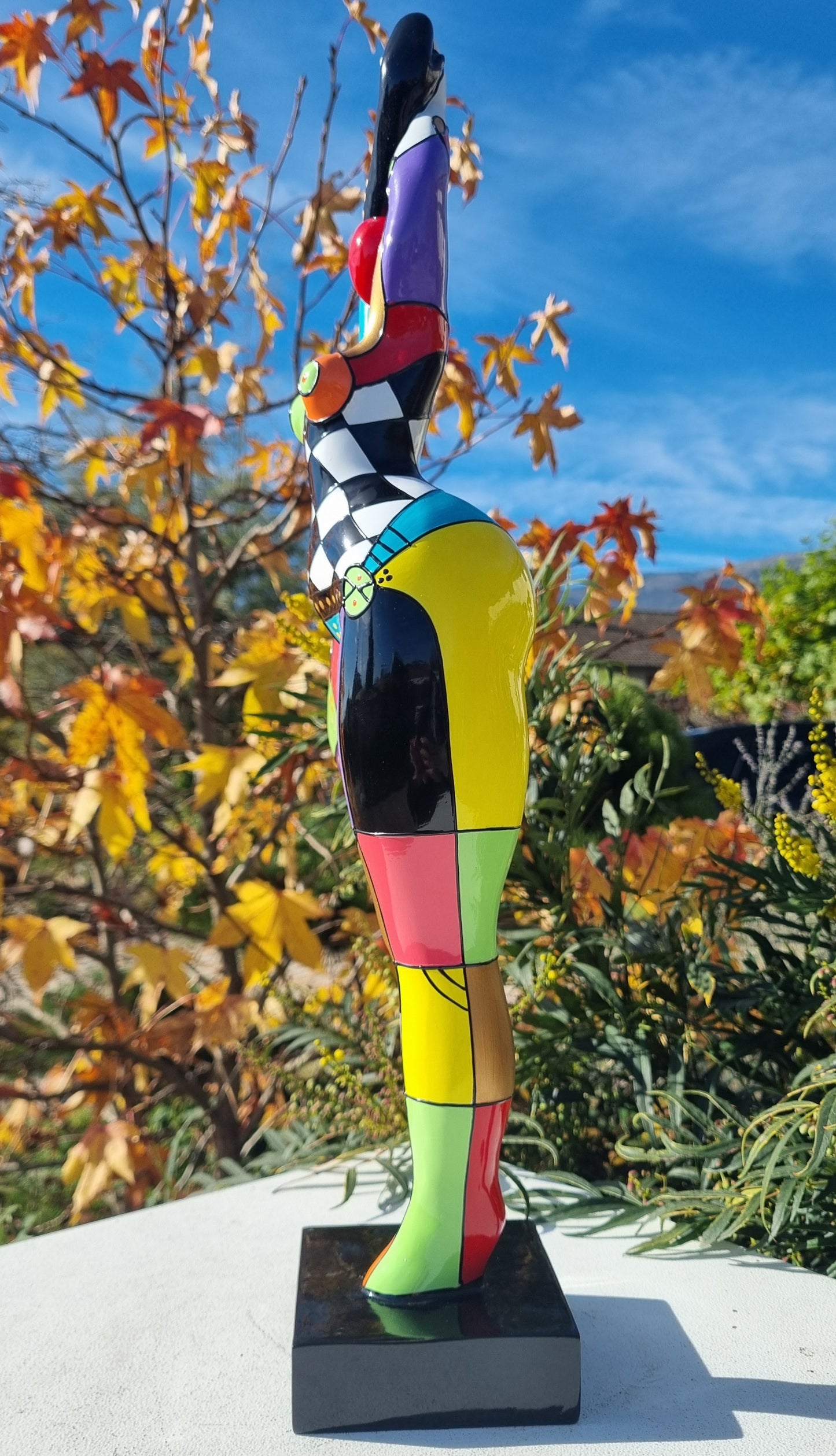 Statue of a dancing woman, in multicolored resin, height 52 centimeters