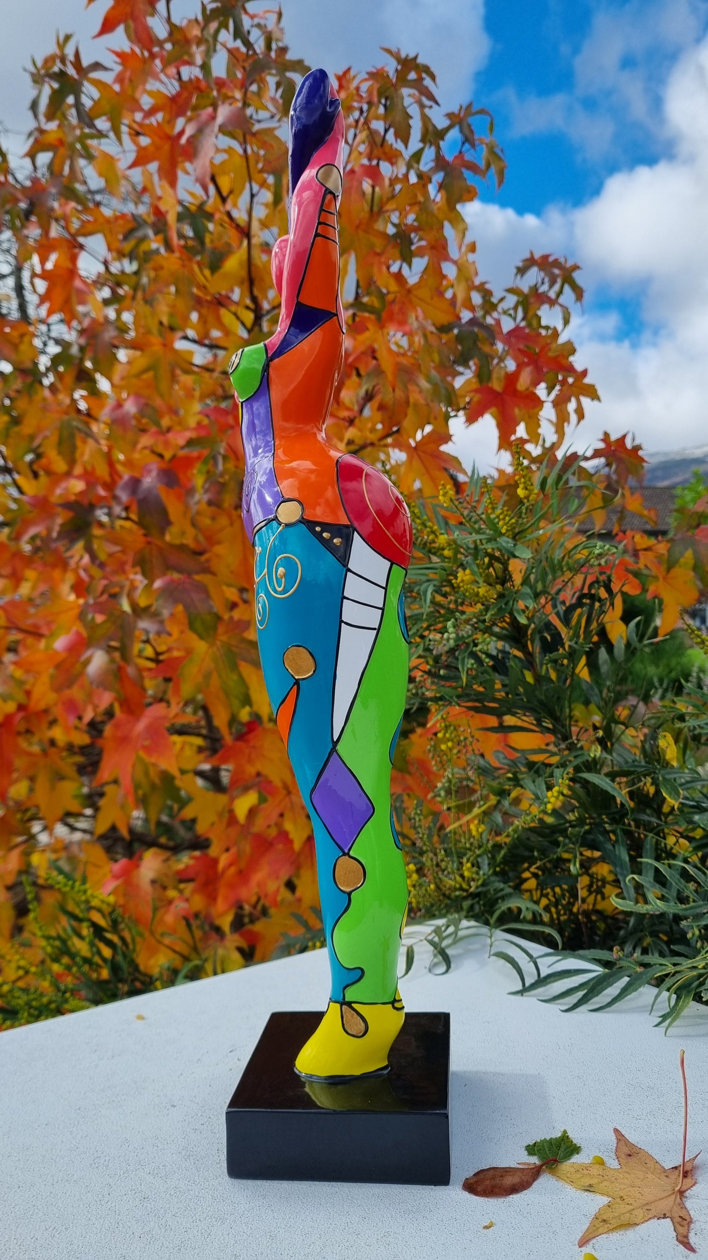 Statue of a dancing woman, in multicolored resin, height 52 centimeters