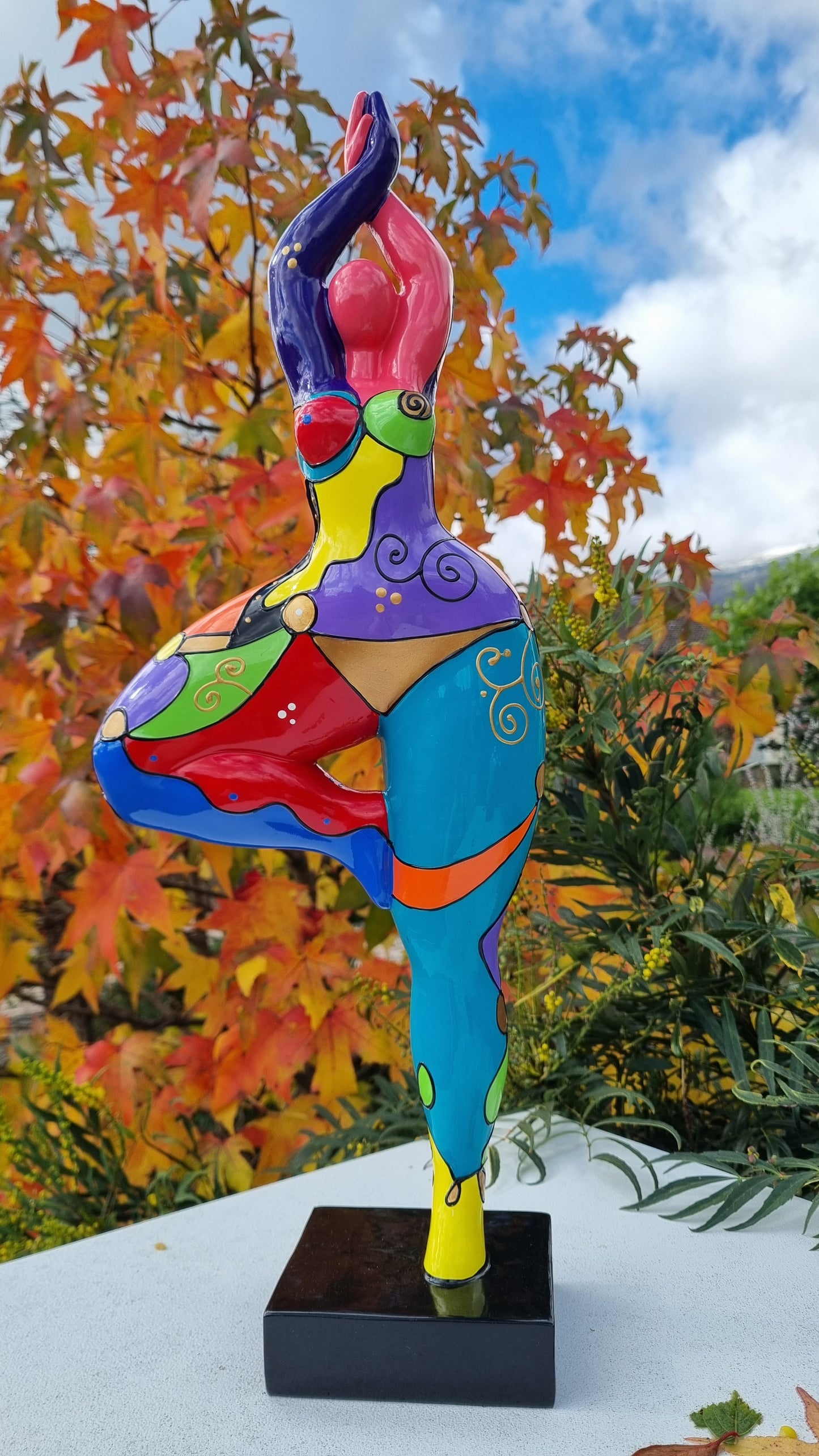 Statue of a dancing woman, in multicolored resin, height 52 centimeters