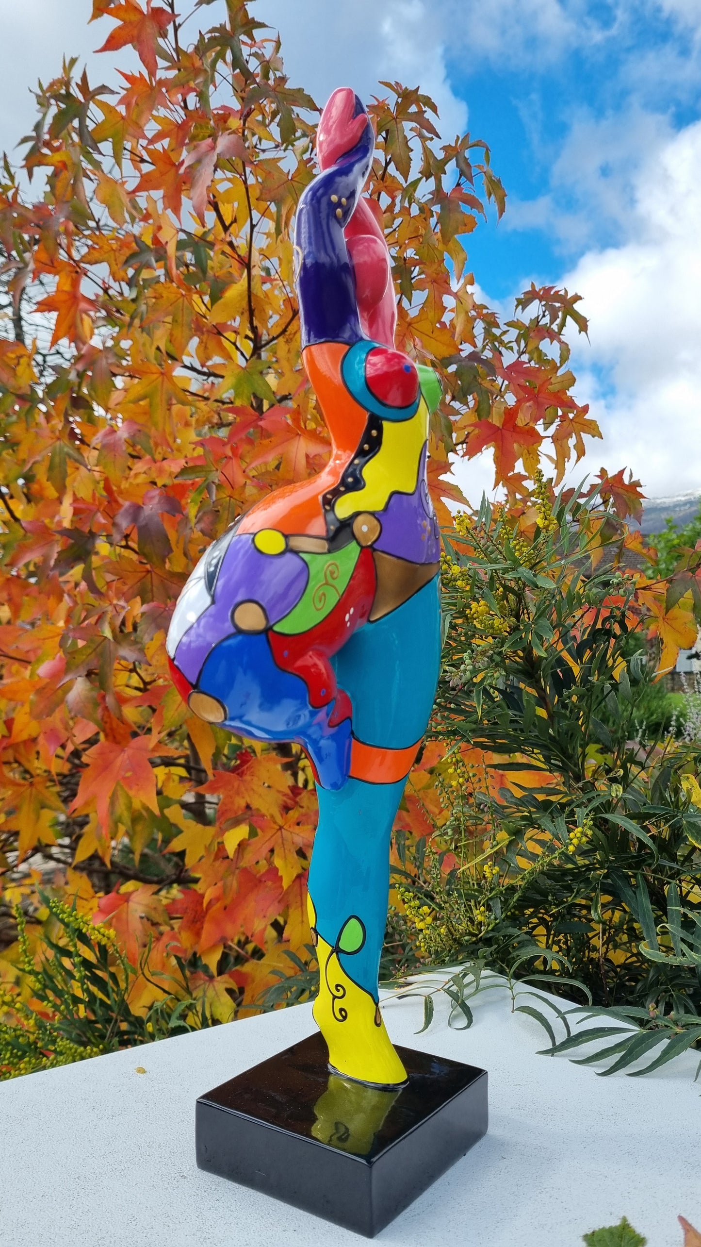 Statue of a dancing woman, in multicolored resin, height 52 centimeters