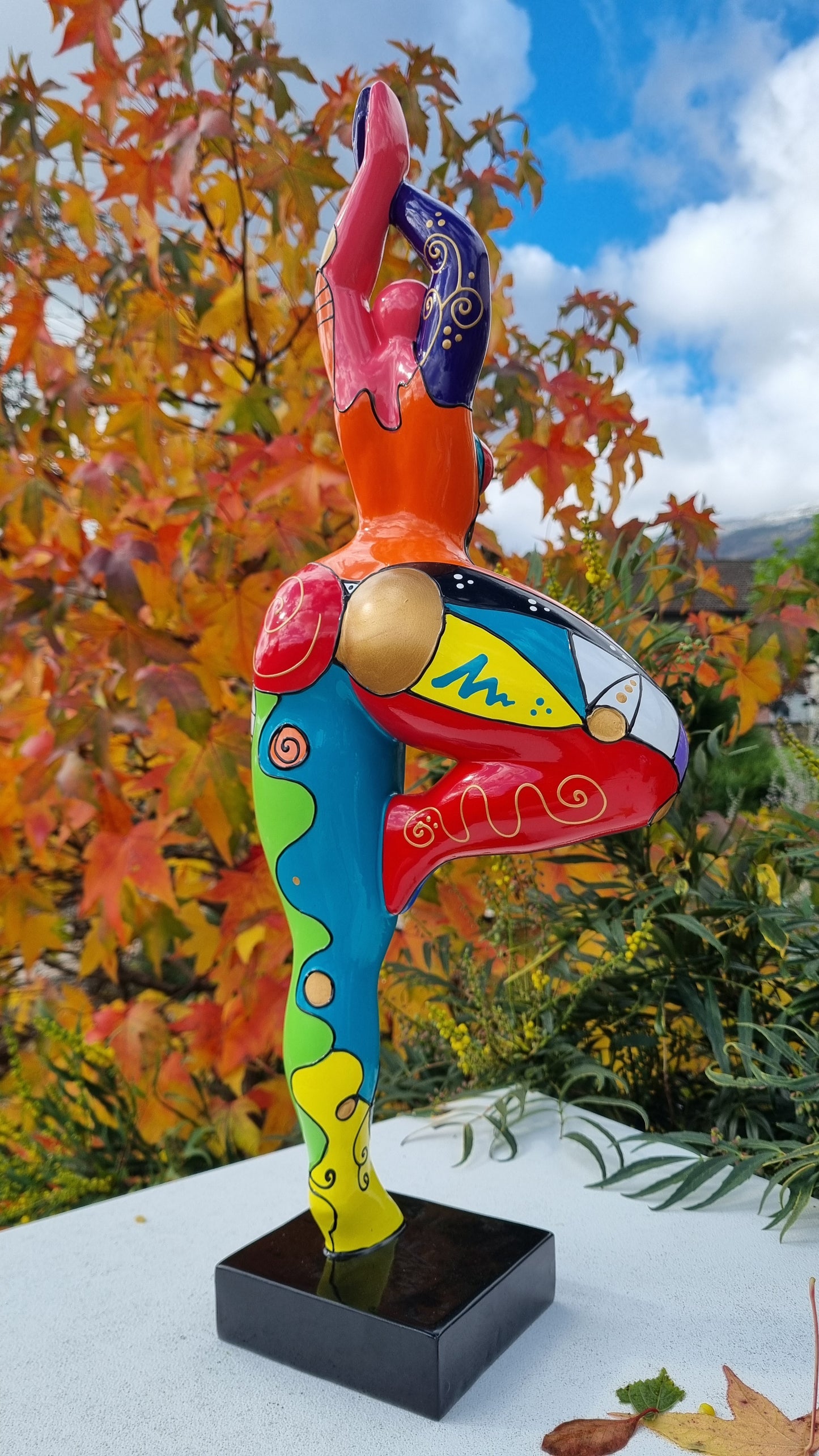 Statue of a dancing woman, in multicolored resin, height 52 centimeters