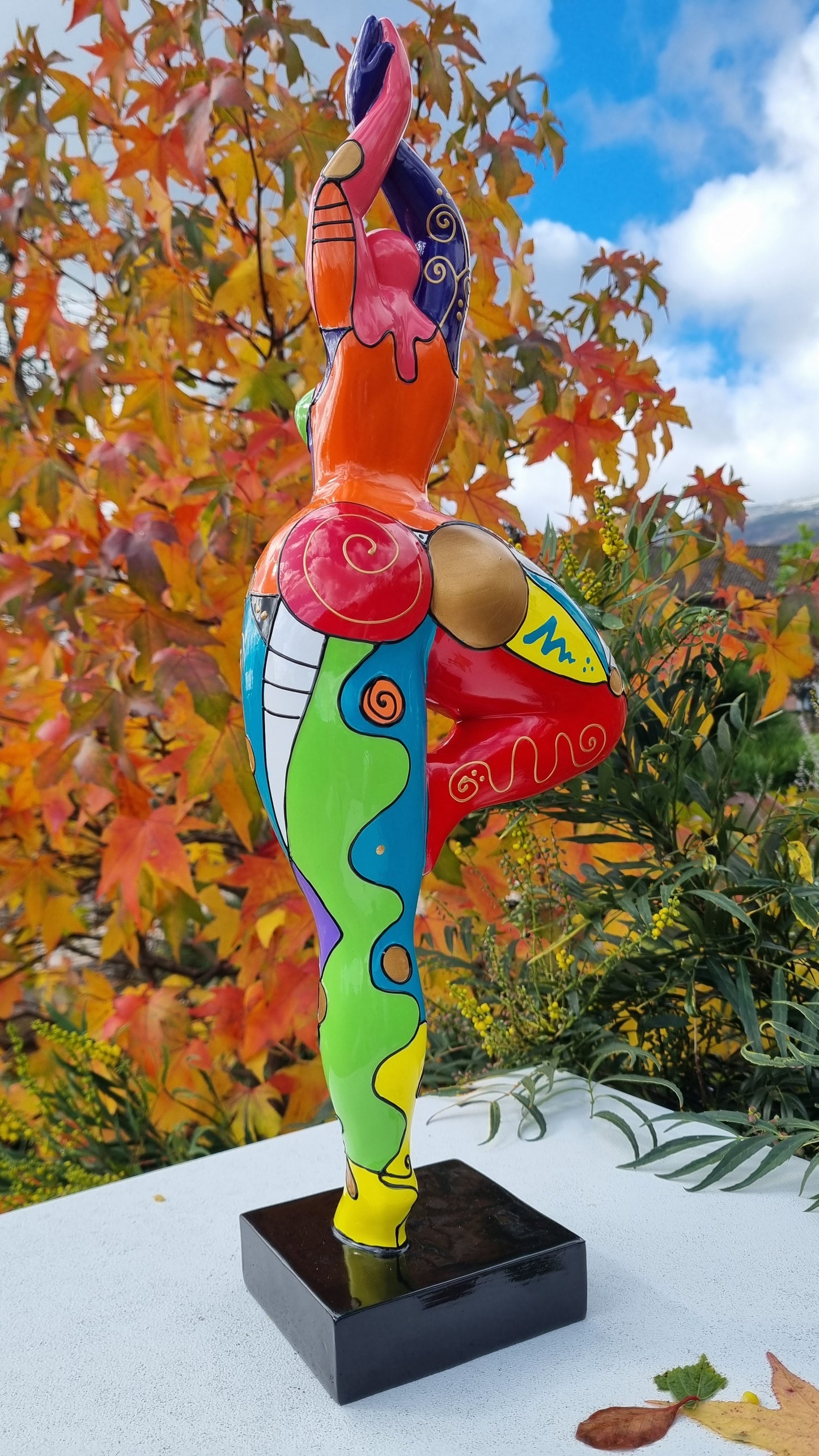 Statue of a dancing woman, in multicolored resin, height 52 centimeters