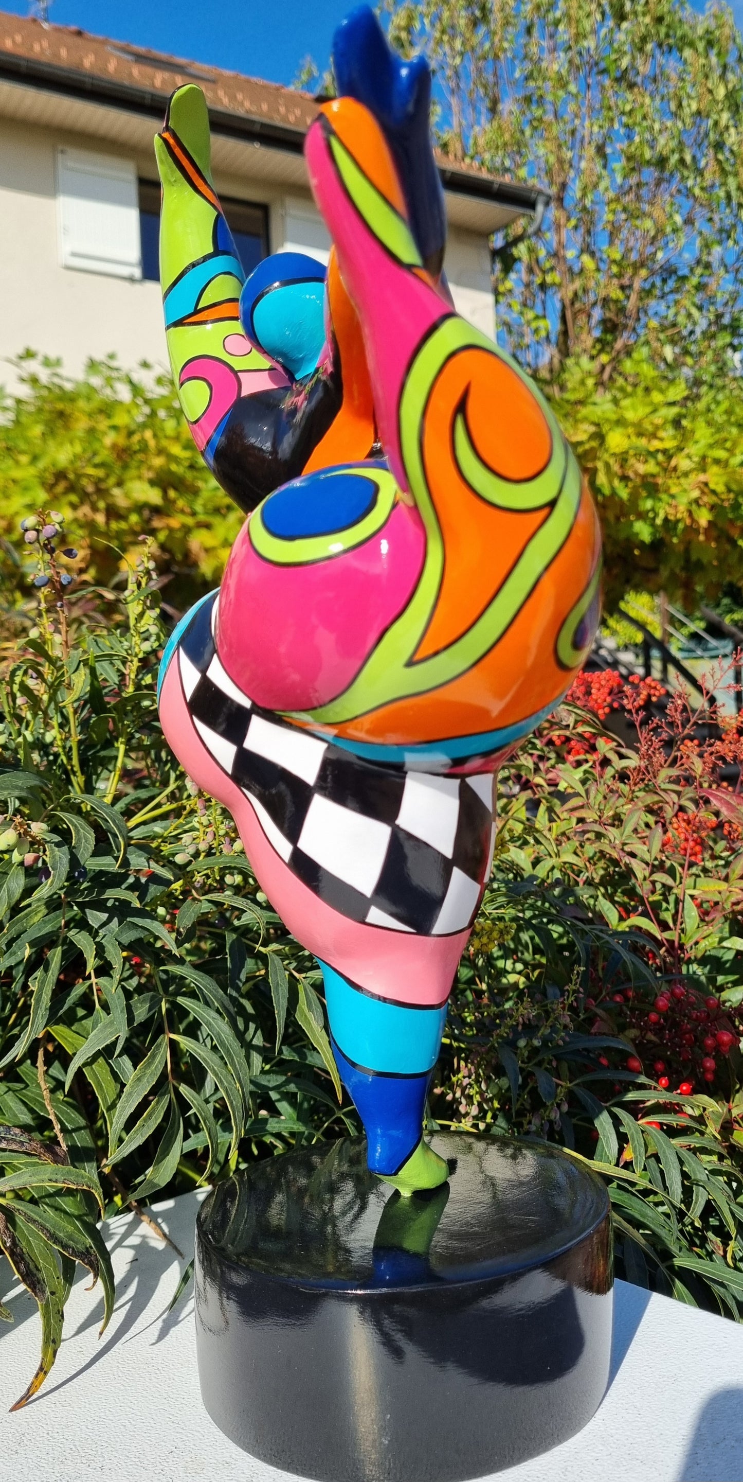 Sculpture of a round & curvy woman, resin colorful. Height 38 centimeters