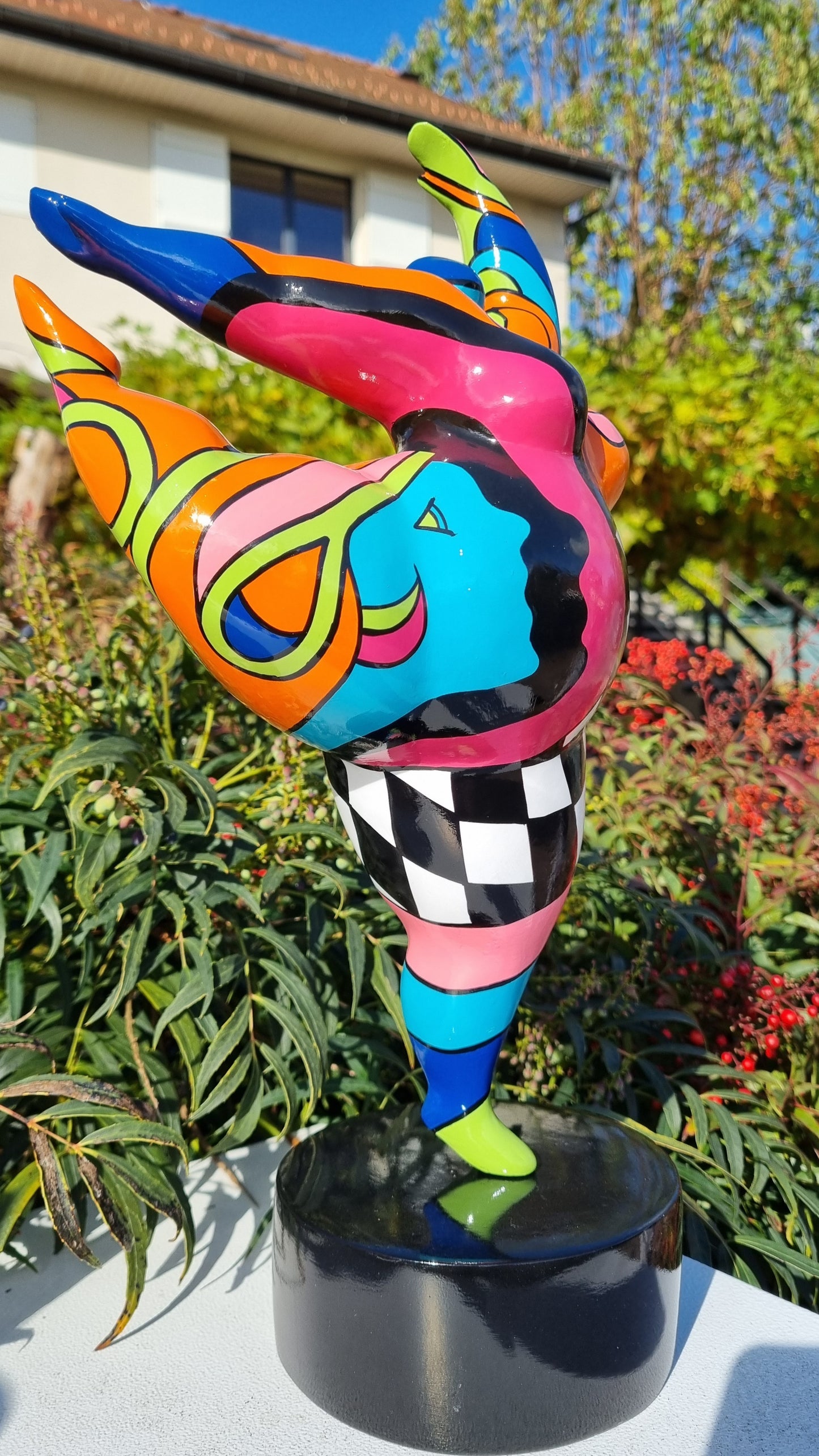 Sculpture of a round & curvy woman, resin colorful. Height 38 centimeters