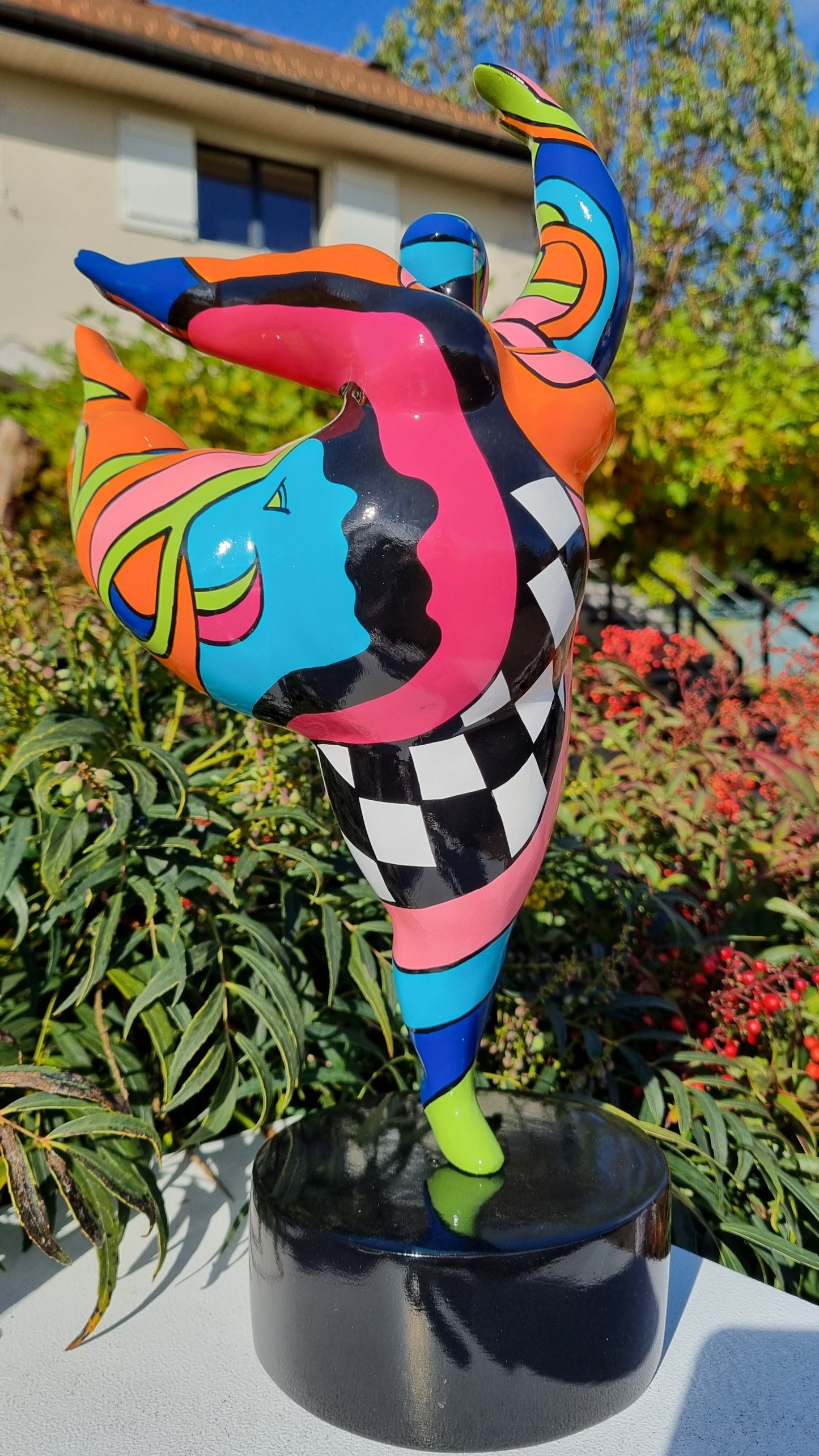 Sculpture of a round & curvy woman, resin colorful. Height 38 centimeters